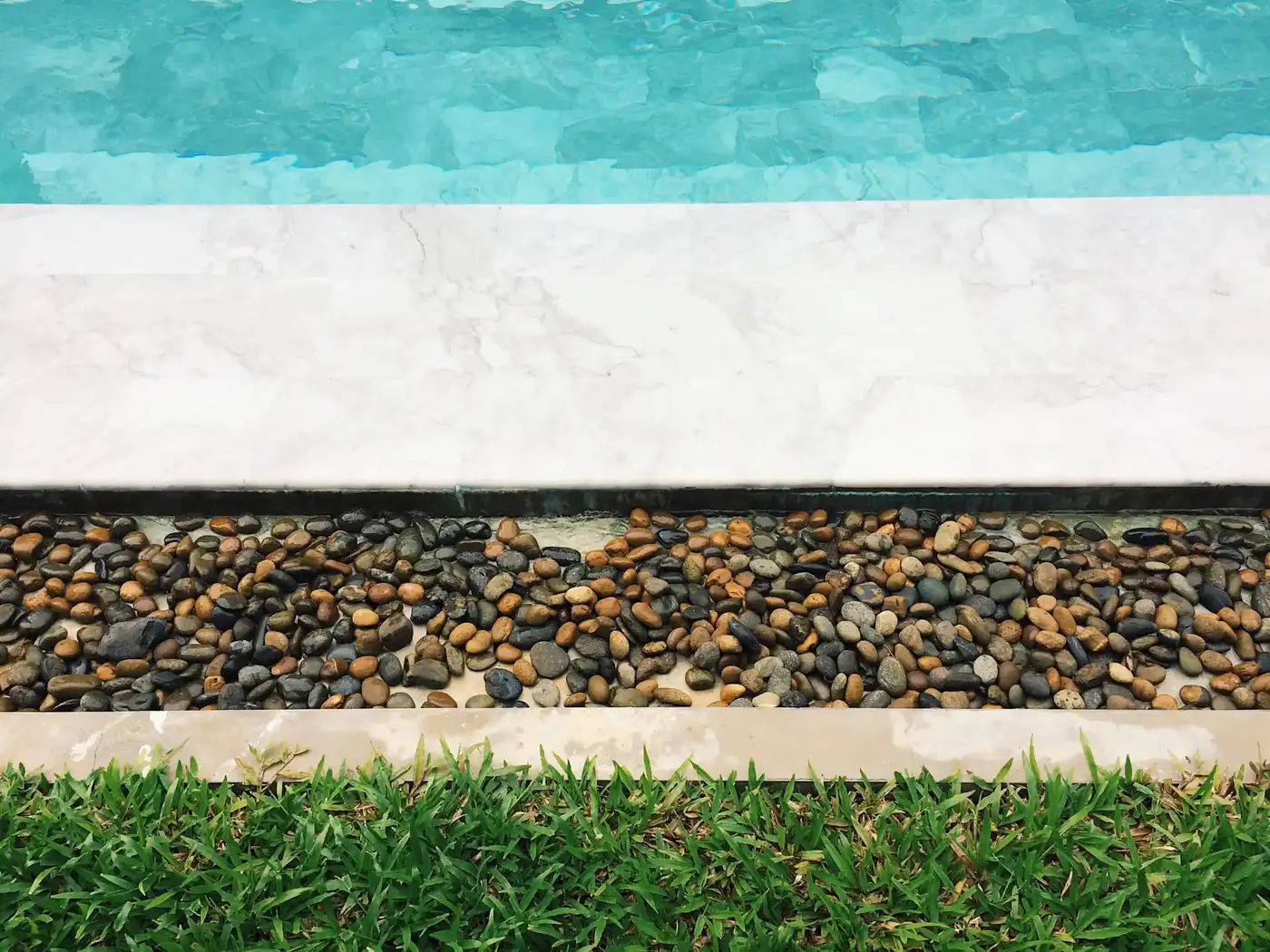 Backyard swimming pool with a wide deck surround and seating area in a Greater Toronto Area property