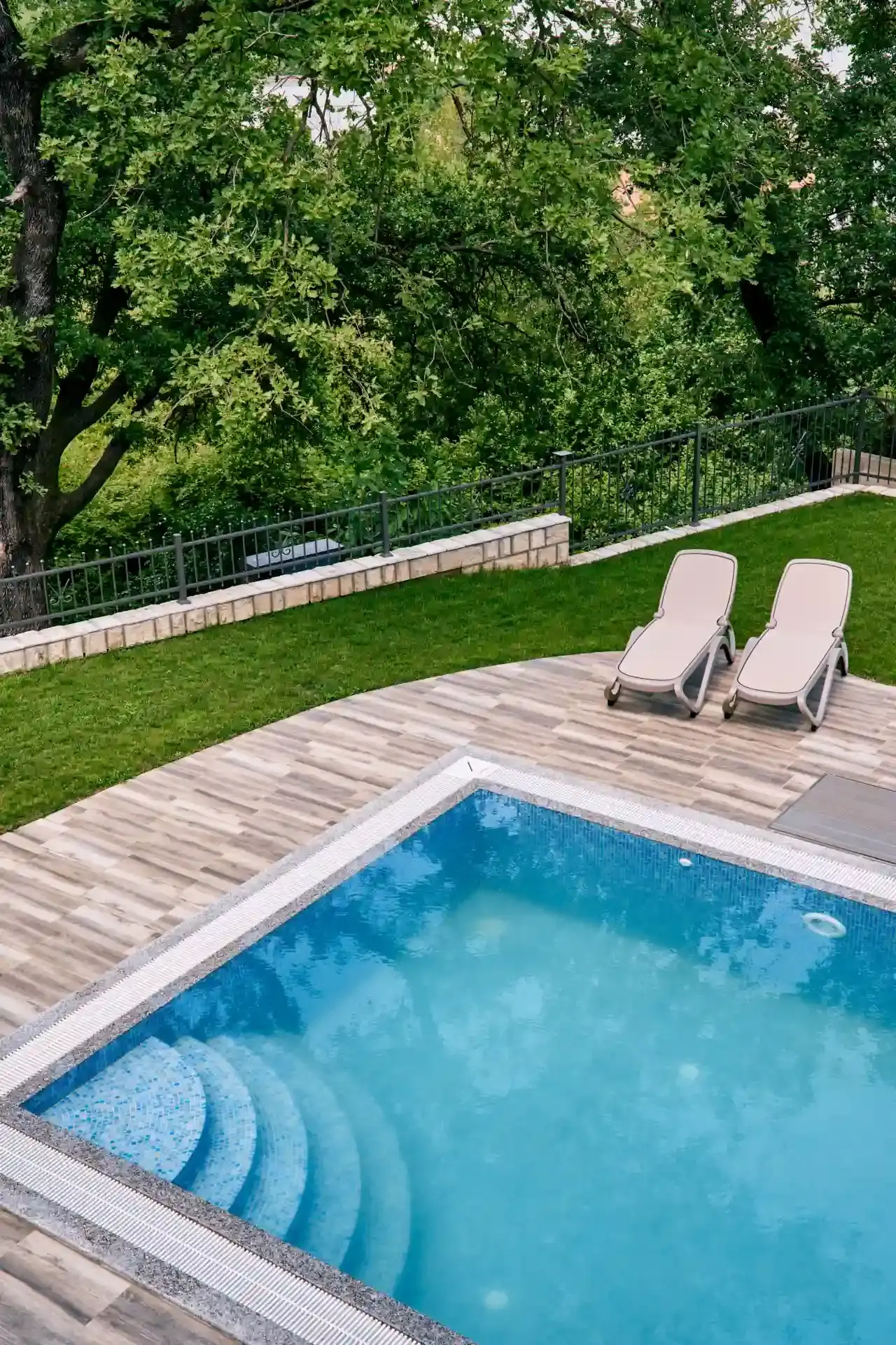 Clean residential swimming pool in Ontario after a full shock treatment and filtration cycle restored water clarity