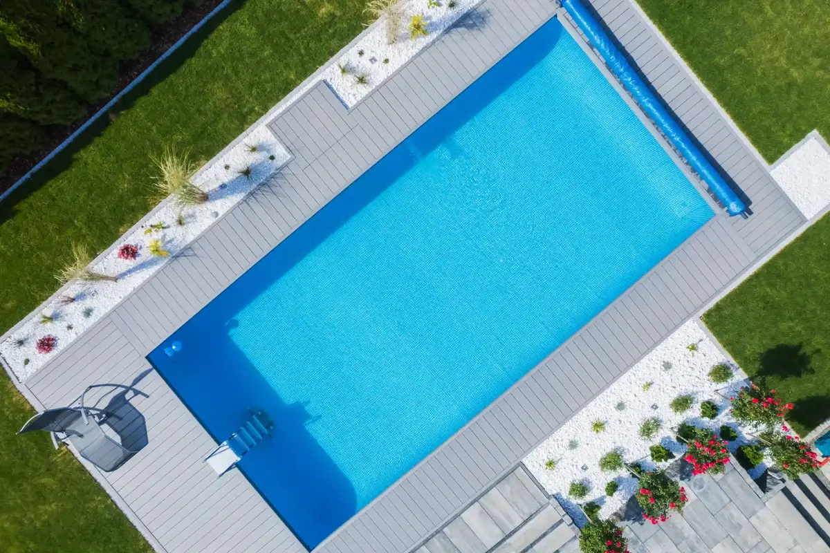 Swimming pool leak repair in Toronto showing a technician performing a bucket test and dye test on an inground pool