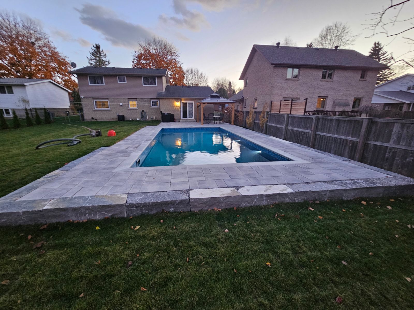 Completed in-ground pool with stone decking in Beaverton, Ontario
